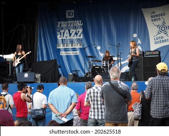 Montreal, Quebec, Canada 2 June  Montreal Jazz Festival 2014  Katy Guillen & The Girls ,   Kansas City Power-trio  Claire Adams Bass  Stephanie Williams Drums . International Blues Challenge  Finalist