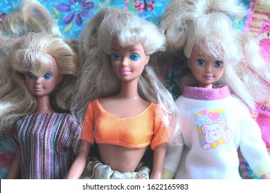 Montreal, Quebec / Canada - 20 January 2020: old dolls at a flea market sale. Second hand vintage toys from 1990s, Barbie and the kind.