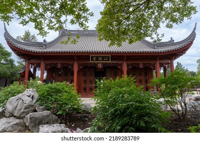 Montreal, Quebec, Canada -2022: Montreal Botanical Garden China area (Jardin botanique de Montréal, Jardin de Chine). Friendship Hall and Dream Lake in Chinese garden.