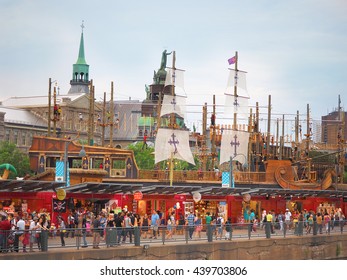 Montreal Quebec Canada  25 July 2015 Old Port Waterfront Family Summer Fun . Children Climbing Rope Ancient Ship Theme Park With Tourist Shopping