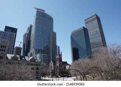 Montreal, Quebec, Canada - April 12, 2022: View Of 1250 Boulevard René Lévesque And Other Skyscrapers Surrounding Saint George's Anglican Church