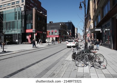 Montreal, Quebec, Canada - April 12, 2022: Streetscape of Rue Sainte-Catherine in downtown Montreal