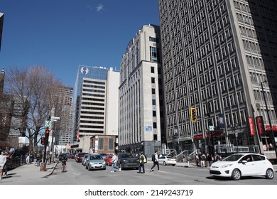 Montreal, Quebec, Canada - April 12, 2022: Streetscape of Rue Sherbrooke at the intersection with Boulevard Robert-Bourassa