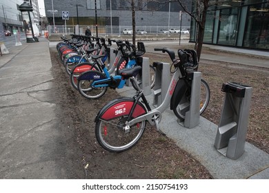 Montreal, Quebec, Canada - April 14, 2022: A Bixi Bike Share Docking Station On The Sidewalk Of Avenue Viger