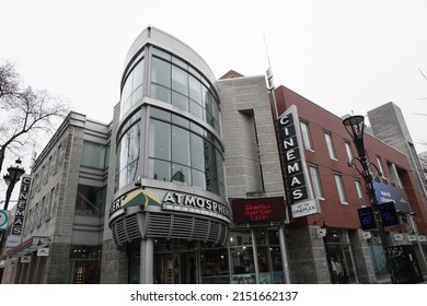 Montreal, Quebec, Canada - April 14, 2022: View Of The Cinéma Cineplex Odeon Quartier Latin Movie Theater And The Atmosphere Outdoor Sports Store