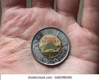 Montreal, Quebec / Canada - January 15 2020: Colored Bimetallic Coin, Two Canadian Dollars (toonie). D-Day Commemorative Design Honoring Heroes Of Operation Neptune (Normandy Landings) Of World War II