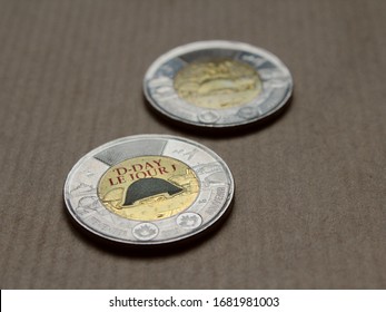 Montreal, Quebec / Canada - January 15 2020: Colored Bimetallic Coins, Canadian Dollars (toonie). D-Day Commemorative Design Honoring Heroes Of Operation Neptune (Normandy Landings) Of World War II.