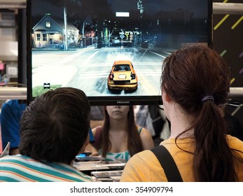 Montreal Quebec Canada - July 12 2014 Mondial De Jeux World Of Games Children Playing Video Game And Dance On Plasma Large Television Screen 