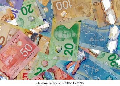 Montreal Quebec Canada November 22 2020:  Canadian Money The Currency Of Canada Commonly Called Bills Or Bank Notes Spread Out With 5, 10, 20, 50 And 100 Dollar Bills For A Background 