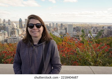 Montreal, Quebec - Canada - October 10, 2022: Tourist At Mount Royal Park. Landscape View Of Montreal In The Background.