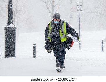 MONTREAL, QUEBEC, CANADA:  A Canada Post Worker Delivers Mail During A Snowstorm In Montreal, Quebec, Canada, Monday, January 17, 2022. Photo Graham Hughes