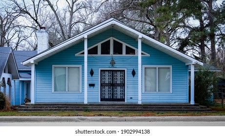 Montrose, Arkansas United States - January 2 2020: a blue house with a symmetrical facade 