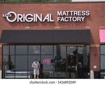 Montrose, Ohio / USA 6-1-2019: Store Front Of The Original Mattress Factory With Person Waiting Outside