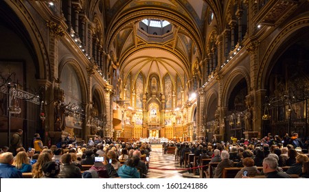 Montserrat Monastery, Monserrat, Catalonia, Spain - Nobember 22, 2019:
Many Tourists Are Listening To Church Boys Choir Singing.