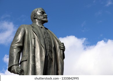 Monument to Lenin, the leader of the russian proletariat against blue sky with white clouds - Shutterstock ID 1333842995