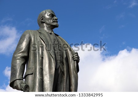Monument to Lenin, the leader of the russian proletariat against blue sky with white clouds