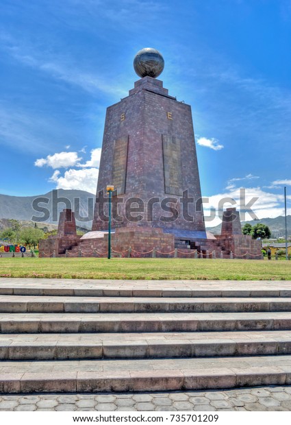 Monument
at the Middle of the World, touristic attraction, north of the
capital of Ecuador, Quito, on a sunny summer
day