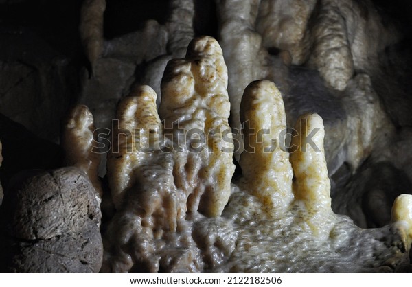 A monument of nature Potpece cave in\
Western Serbia Europe.Under the ground.Beautiful view of\
stalactites and stalagmites in an underground\
cavern