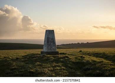 A monument on a hillside in South Downs National Park, sunset, cloudy, Brighton, UK