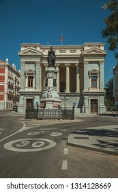 Monument On Street In Front The West Facade Of Casón Del Buen Retiro, An Annex Of The Prado Museum Complex In Madrid. Capital Of Spain This Charming Metropolis Has Vibrant And Intense Cultural Life.