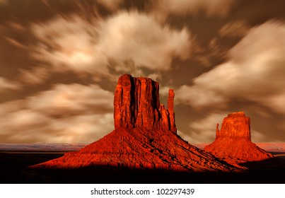 Monument Valley Arizona, The Red Rock Buttes, also called Mittens Under An Impressive Sky