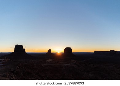 Monument Valley Buttes Sunrise Silhouette - Powered by Shutterstock