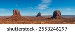 Monument valley landscape Utah USA. The west and east Mitten and the Merrick Butte. Stunning blue sky