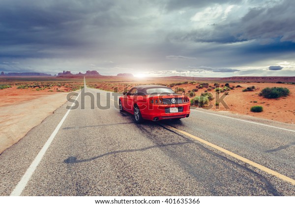 MONUMENT VALLEY ,UTAH, USA JUNE 6, 2015: Photo of\
a Ford Mustang Convertible 2012 version at Monument Valley,Utah,\
USA. The fifth generation began with the 2005 model year to\
2014.TONED Image.