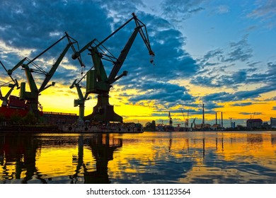 Monumental Cranes at sunset in Shipyard.