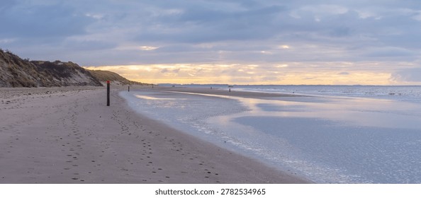A Moody Beachscape with Dramatic Clouds at Sunset