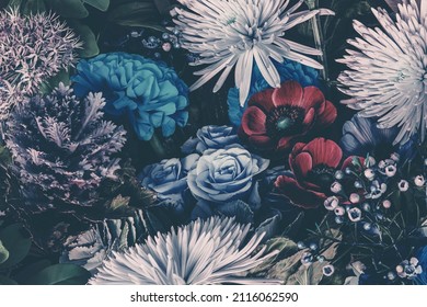 Moody dark close-up photo of blue and purple garden flowers. Floral pattern