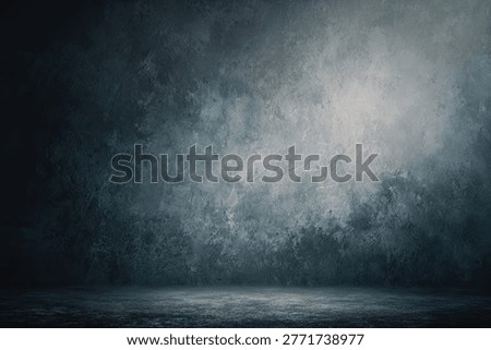 A moody, dark studio backdrop with a rough, textured concrete wall and floor, illuminated by a single spotlight creating a dramatic effect.