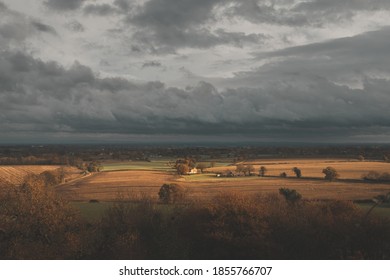 Moody Dramatic Shot Of Small Farm House Surrounded By Farmland Fall Autumn In UK