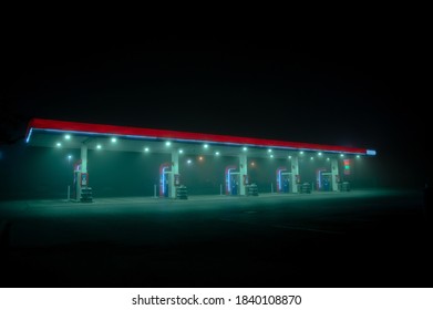 Moody Empty Gas Station On A Foggy Night