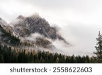 Moody landscape in the autumn in the Dolomites near Canazei