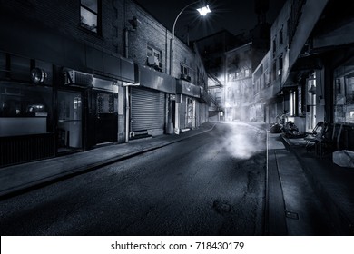 Moody Monochrome View Of Doyers Street By Night, In NYC Chinatown. The Bend Became Known As 