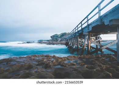 Moody Ocean Bridge And Rocks