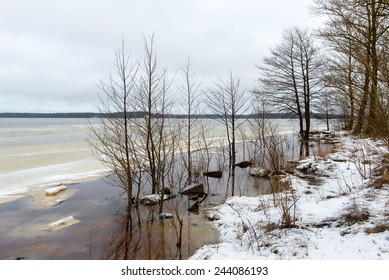 moody overcast winter day at the lake with rain and raindrops, dramatic sky - Shutterstock ID 244086193