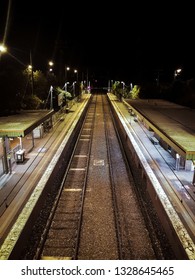 Moody Photo Of Spooky Empty Train Station In Melbourne City Suburb Australia Late At Night On Summer Evening With No Passengers 