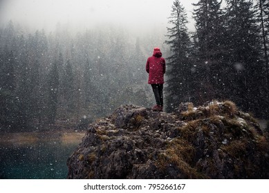 Moody Picture Of Young Explorer During A Snow Fall