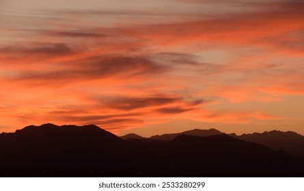 moody sunset over  colorado's front range  of the rocky  mountains  in autumn,  looking towards boulder, as seen from broomfield, colorado - Powered by Shutterstock