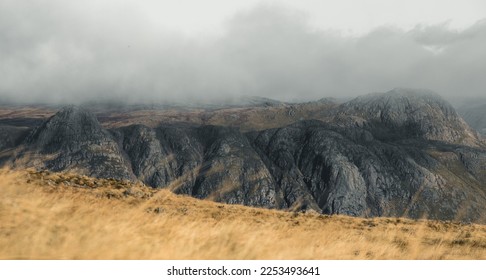 Moody view of Pike of Stickle in the Lake District National Park in England, taken from Crinkle Crags.  - Shutterstock ID 2253493641