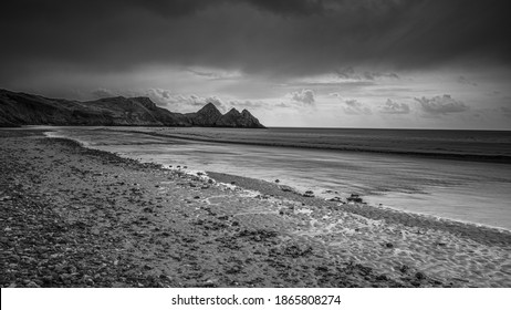 Moody view of Three Cliffs Bay.  The Gower Peninsular, south Wales. Black and White