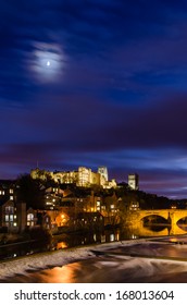 Moon above Durham City at dusk / The Durham City skyline is dominated by its medieval castle and cathedral both sitting high above the River Wear