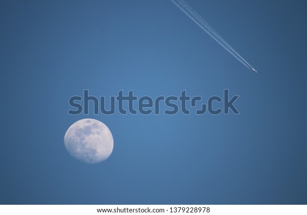 Moon and\
airplane