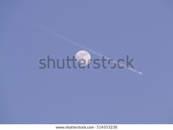The Moon and Airplane on blue sky,Multiple\
Exposure technique