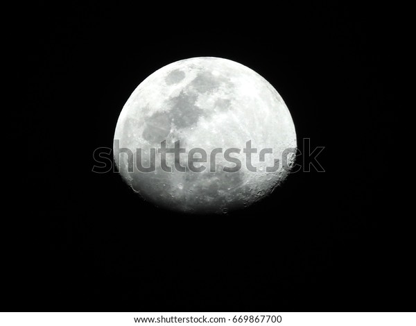 Moon\
Background / The Moon is an astronomical body that orbits planet\
Earth, being Earth\'s only permanent natural satellite. It is the\
fifth-largest natural satellite in the Solar\
System