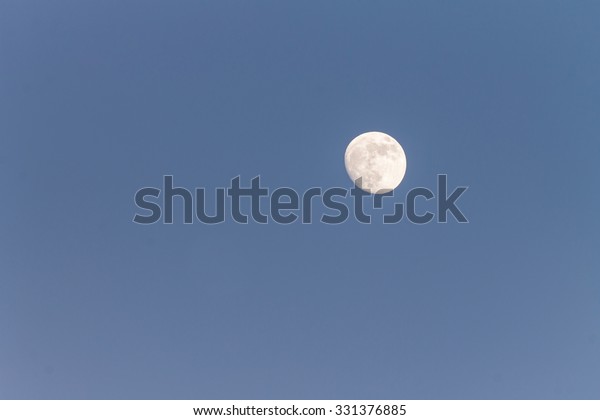 moon with blue\
cloud