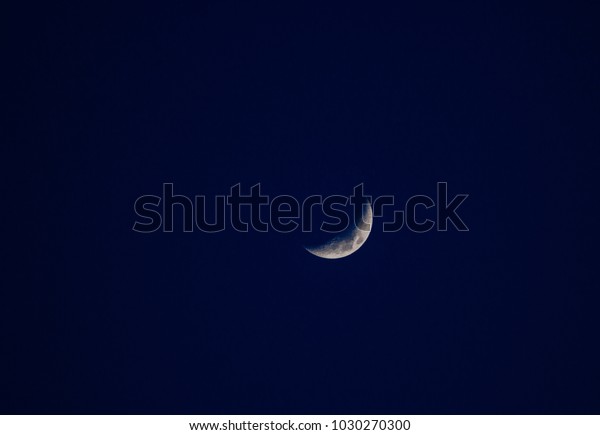 The moon with the blue\
sky