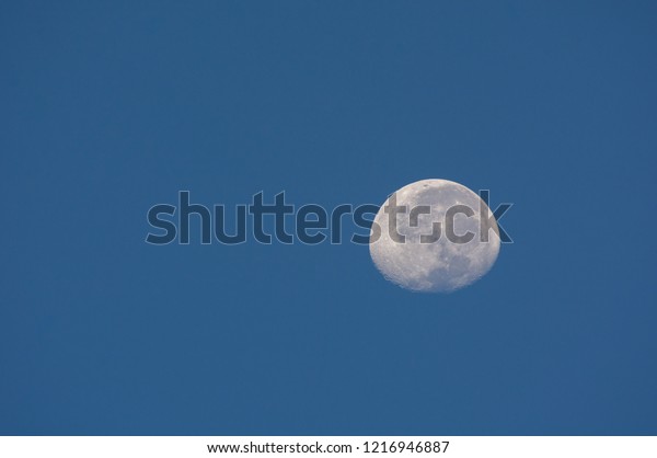 Moon with blue\
sky